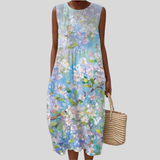 Weißes Kleid mit pastellfarbenen Blüten