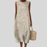 Beige robe with ornamental embroidery